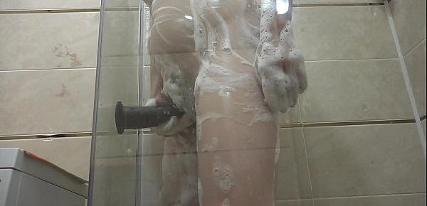 Pregnant milf in the lather in the shower masturbates with a dildo. Rubber dick fucks hairy pussy.